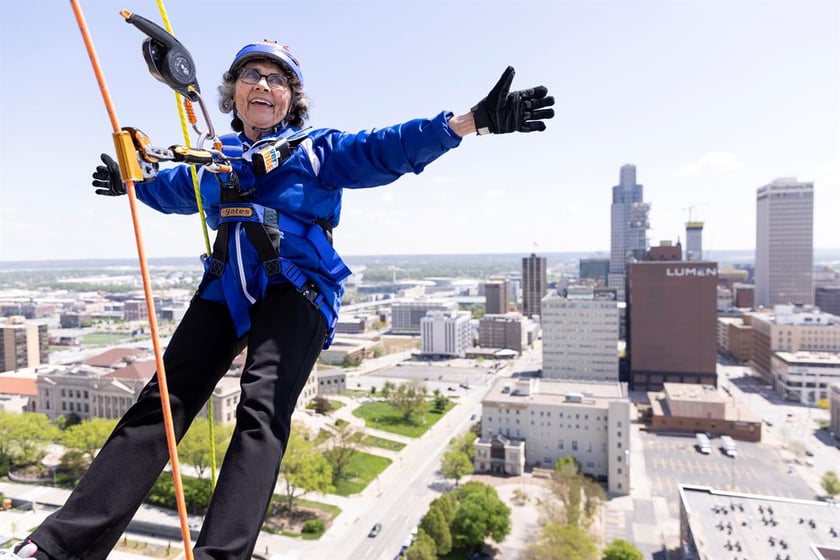 Sister Stephanie Matcha, 81, raised more than $3,000 as part of a fundraiser to support the Siena Francis House when she rappelled down the side of The Highline Apartments in downtown Omaha on May 3. Photo by Anna Reed for the Flatwater Free Press