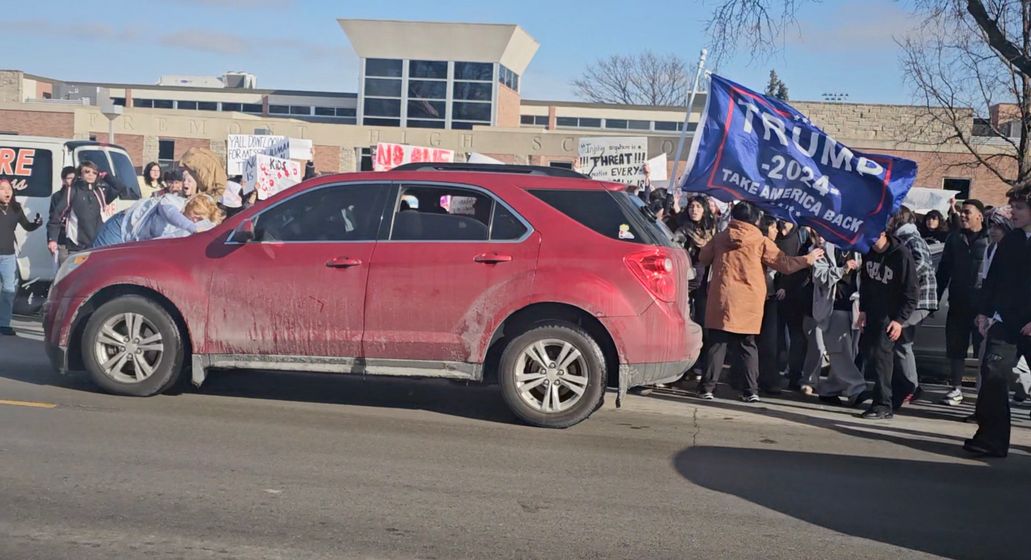 SUV with Trump flag drives into protester, injuring her